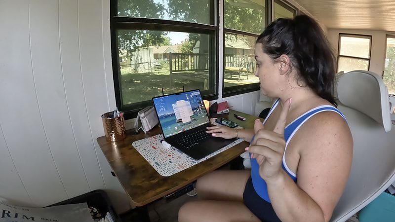 Stephanie adjusting digitized artwork on a screen
