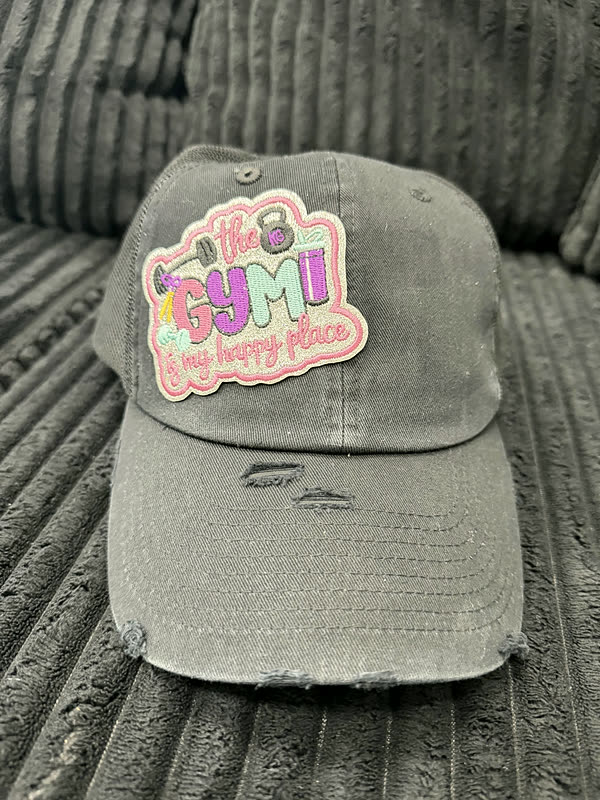 A distressed grey cap with a single colorful word patch on the front panel.