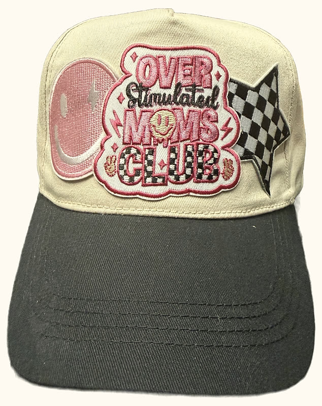 A two-tone cream and black trucker cap with a large chenille club patch and a checkered flag, photographed against white.